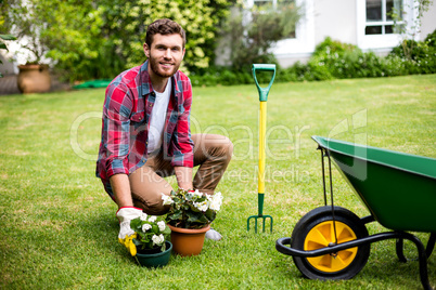 Smiling man woking in yard