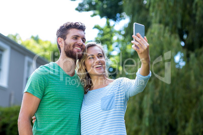 Happy couple taking selfie Happy couple taking selfie