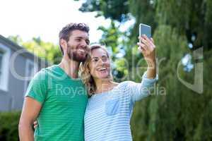 Happy couple taking selfie