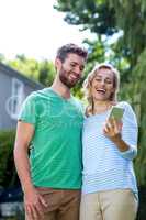 Happy couple taking selfie