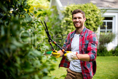 Gardener cutting plants