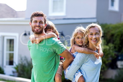 Parents piggy-backing children