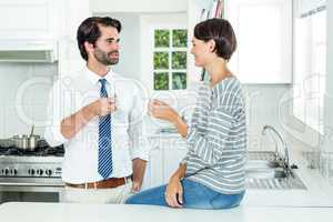 Woman interacting with businessman during coffee break