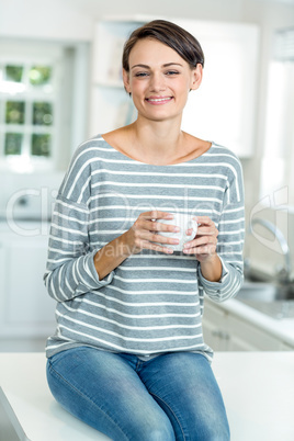 Portrait of happy beautiful woman with coffee