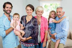 Cheerful multi-generation family in living room