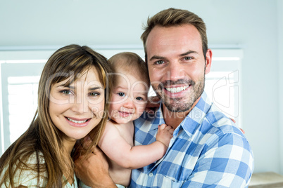 Portrait of happy parents with son