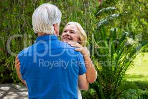 Romantic senior couple embraing at park