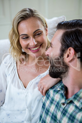 Happy young woman looking at man