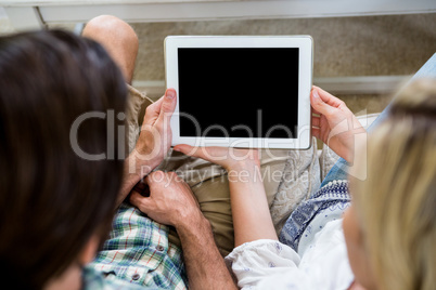 High angle view of couple with digital tablet