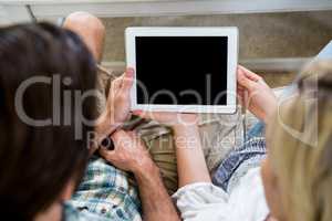 High angle view of couple with digital tablet