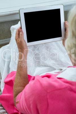 Senior woman holding tablet pc