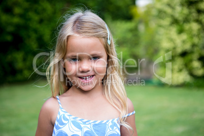 Portrait of cute girl in back yard