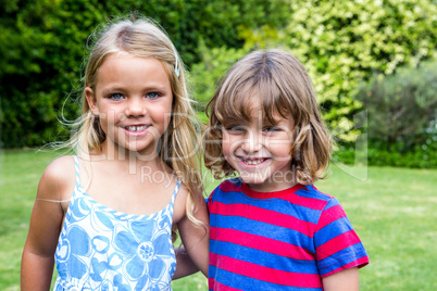 Portrait of siblings in back yard