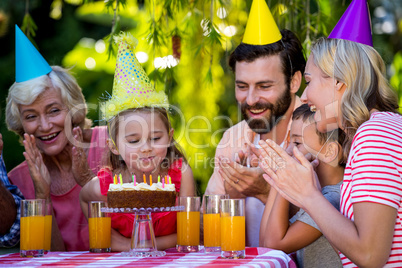 Happy family celebrating birthday of girl