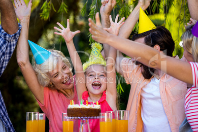 Cheerful family celebrating birthday at yard