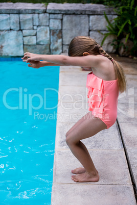 Girl diving into swimming pool