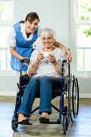 Portrait of happy senior woman with nurse