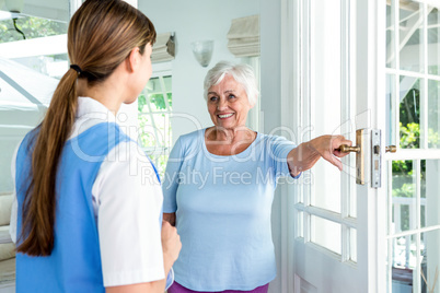 Happy aged woman standing nurse