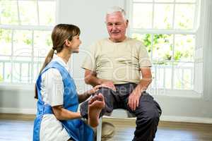 Nurse assisting senior man