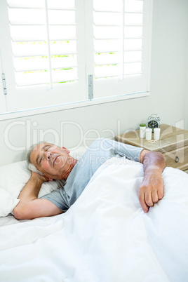 High angle view of aged man sleeping