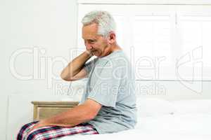 Senior man suffering from neck ache