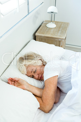 High angle view of aged woman sleeping