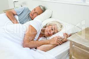 High angle view of senior man and woman sleeping