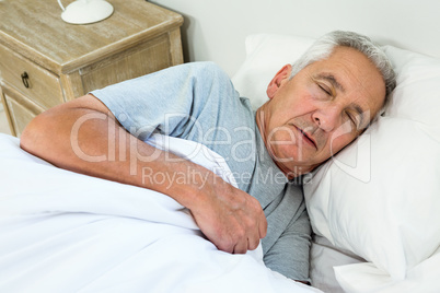 High angle view of old man sleeping