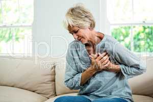 Senior woman suffering from chest pain