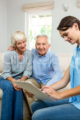 Consultant with senior couple at home