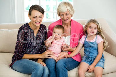 Smiling multi generation family with baby