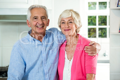 Retired couple with arm around