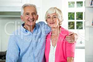 Retired couple with arm around
