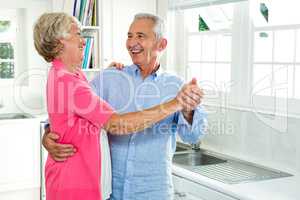 Cheerful senior couple dancing