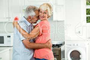 Romantic senior couple with rose