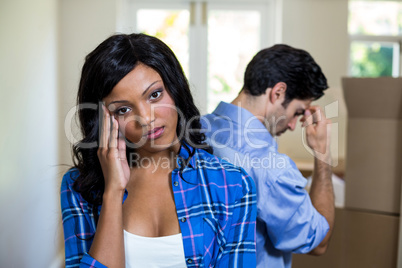 Young couple standing back to back and ignoring each other