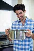 Young man preparing food in kitchen