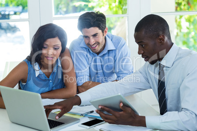 Couple and real estate agent discussing together