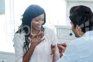 Man gifting finger to woman