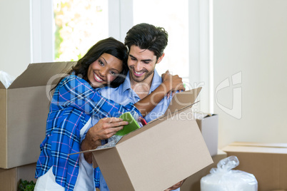 Young couple embracing at home