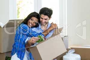 Young couple embracing at home