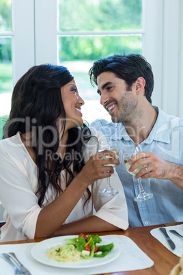 Couple toasting wine glasses