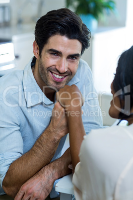 Portrait of happy man holding hand of a woman