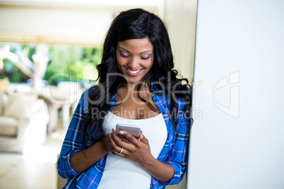 Young woman text messaging on mobile