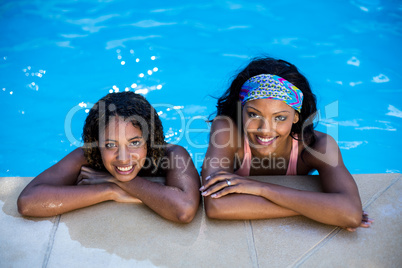 Young women enjoying in the swimming pool