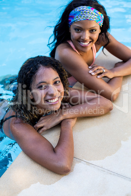 Young women enjoying in the swimming pool