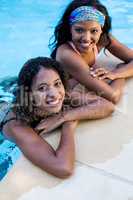 Young women enjoying in the swimming pool