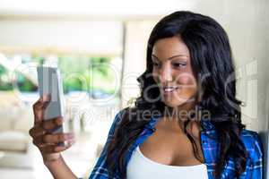 Young woman text messaging on mobile