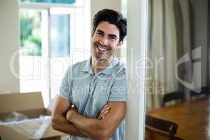 Young man with arms crossed