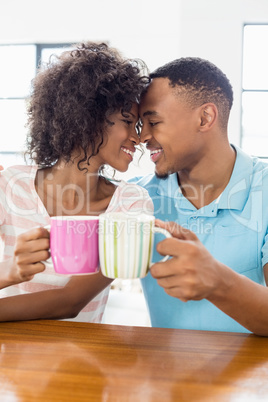 Happy couple toasting coffee mug